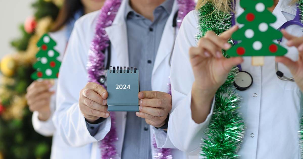 Radiologists holding Christmas trees and calendar "2024".